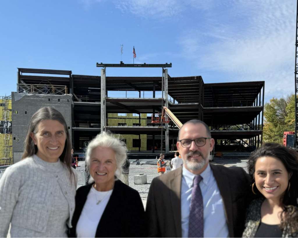 superintendent posing at beam ceremony
